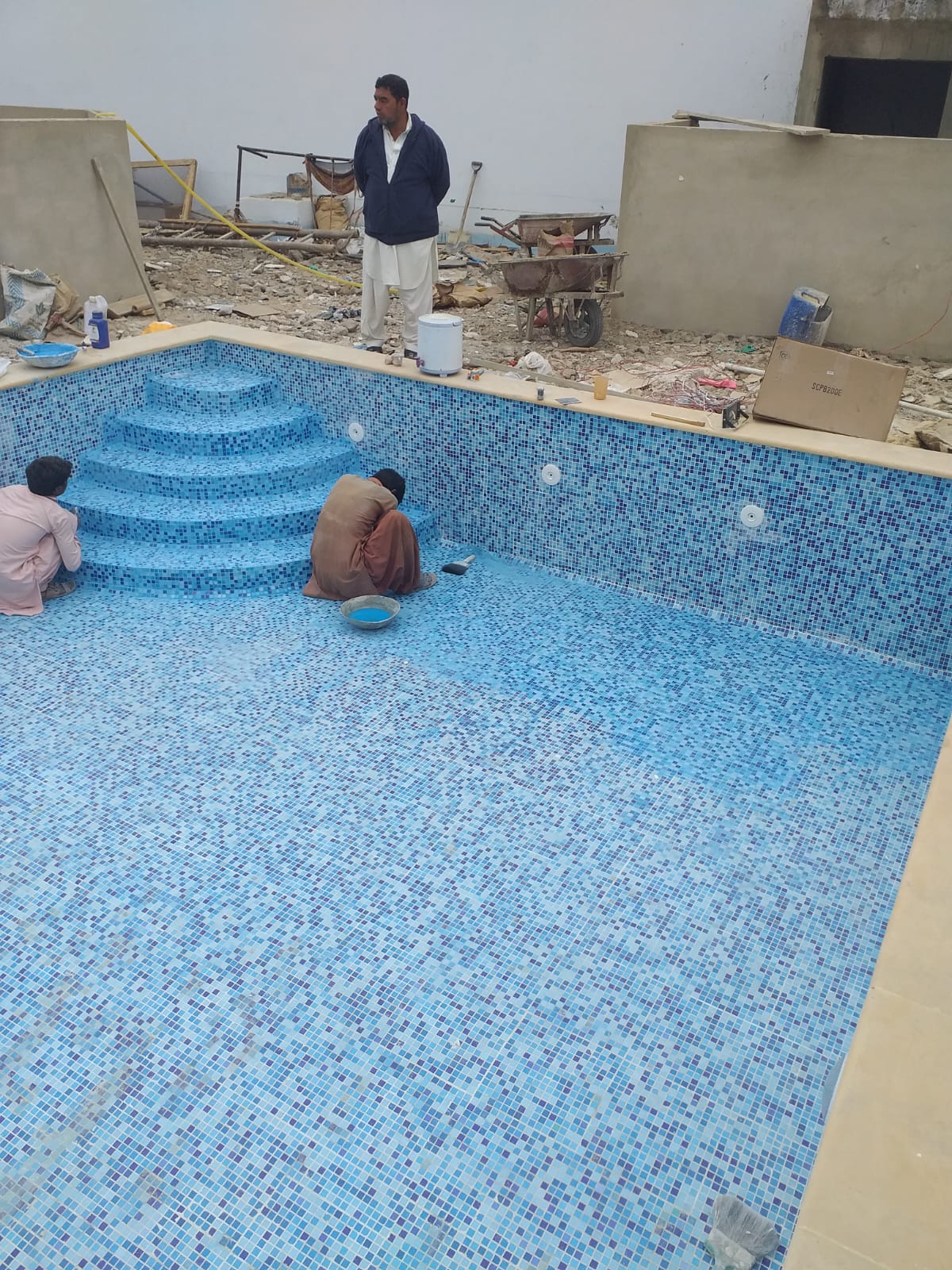 Modern pool with cascading water feature